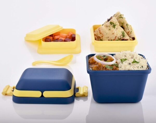 food in plastic lunch box on white background