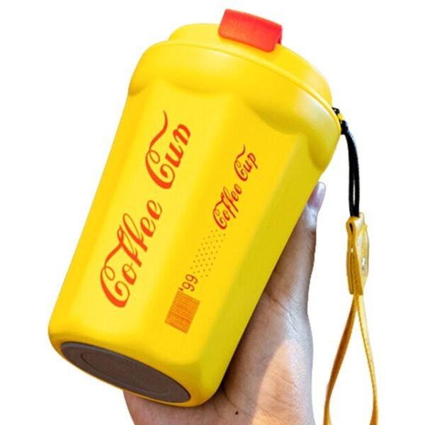 Yellow color coffee cup in hand on white background