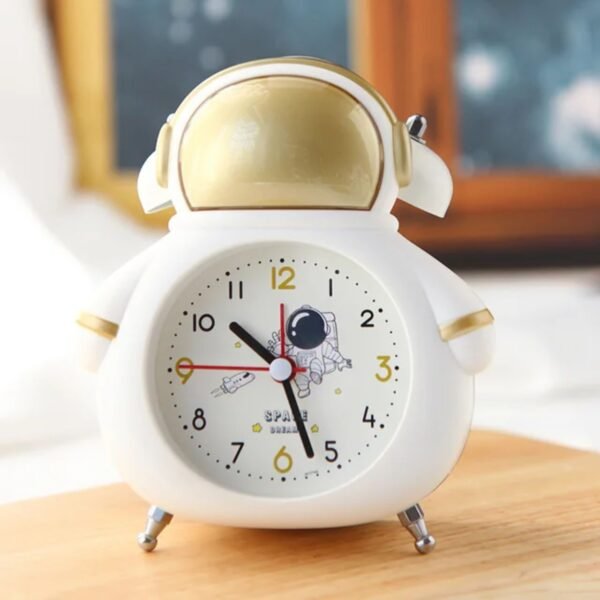 astronaut design alarm clock white color on table