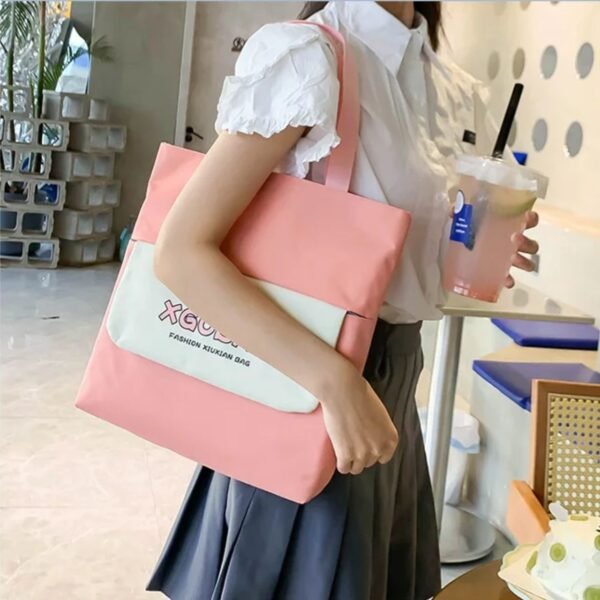 Shoulder bag hanging on girls shoulder on decorative background