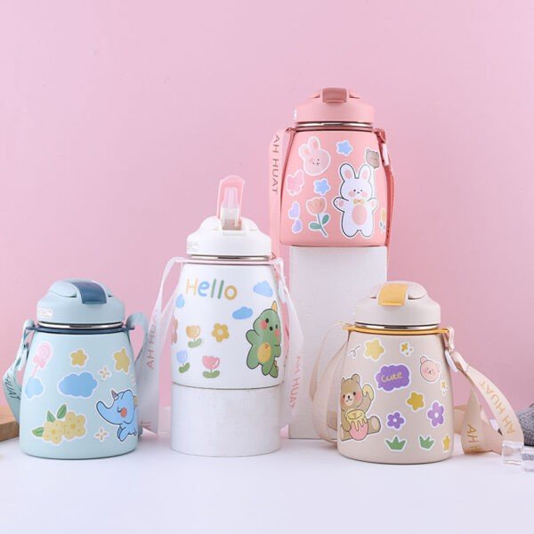 kids thermos cup different colors on decretive background