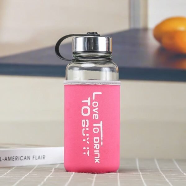 sport glass bottle pink color on decorative background