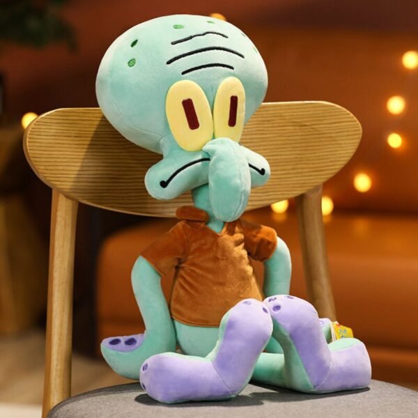 Squidward Tentacles plush toy from spongeBob SquarePants sitting on a wooden chair, featuring his teal head, long nose, and orange shirt, with warm bokeh lights in the background